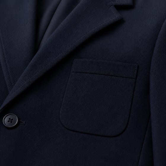 Embroidered school crest on a breast pocket